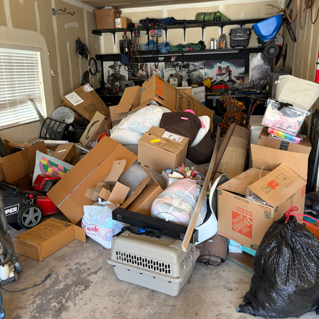 Garage packed with boxes, bags and household items before a cleanout