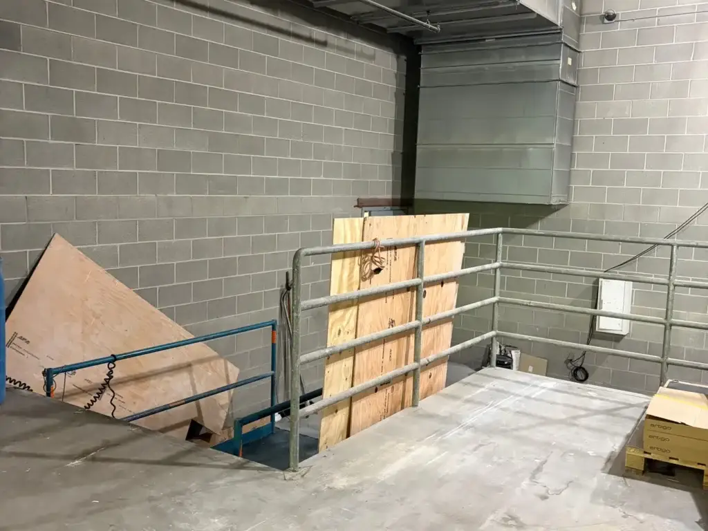 The same commercial interior swept and cleared after Junk Hogs removed the debris